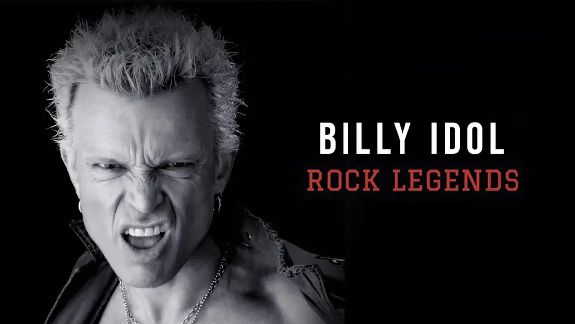 Billy Idol giovane, icona del rock, con espressione grintosa e capelli biondi spettinati.