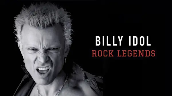 Billy Idol giovane, icona del rock, con espressione grintosa e capelli biondi spettinati.